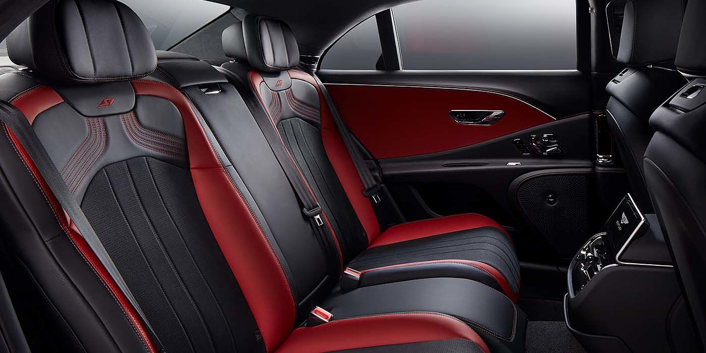 Bentley Zug Bentley Flying Spur S sedan rear interior in Beluga black and Hotspur red hide with S stitching