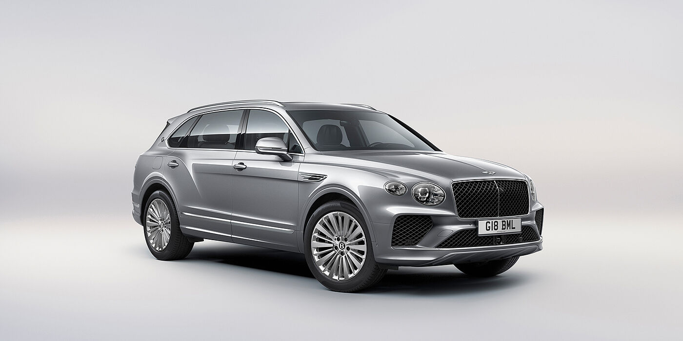 Bentley Zug Bentley Bentayga Extended Wheelbase luxury SUV front three quarter view in Moonbeam paint with 21 inch five spoke painted wheels