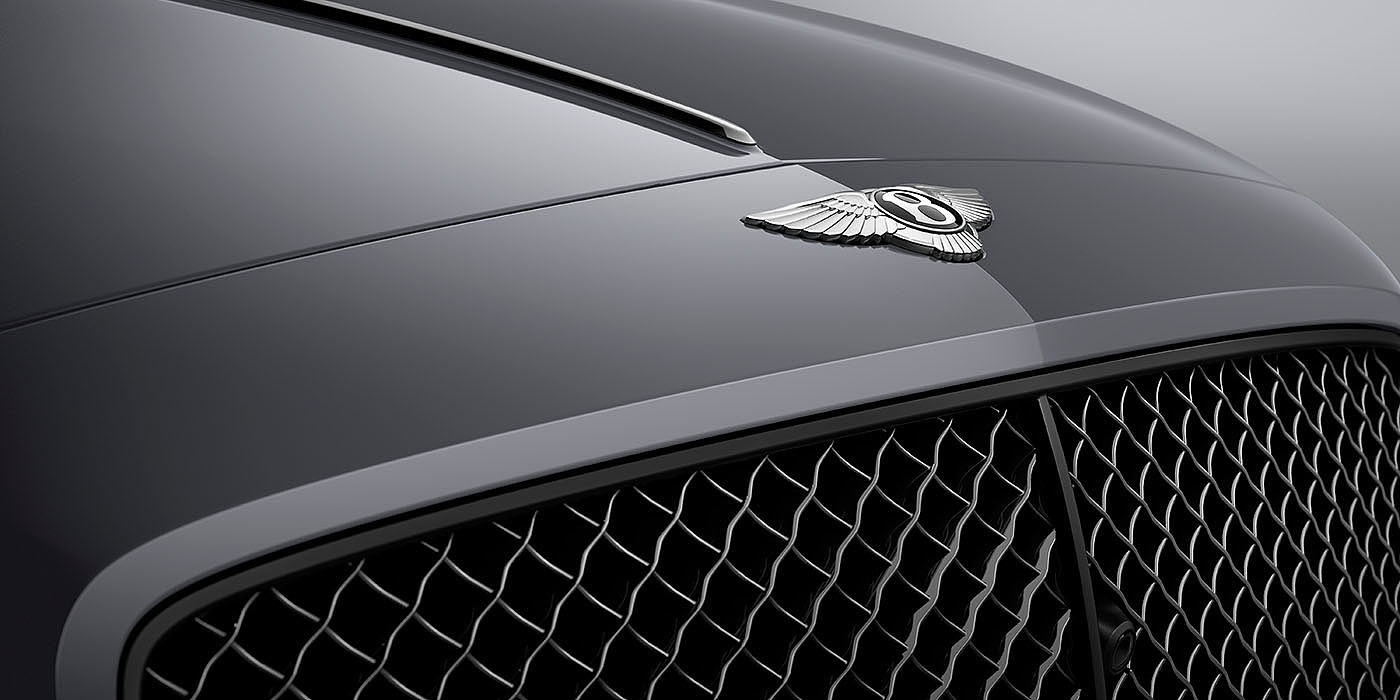 Bentley Zug Bentley Flying Spur S Cambrian Grey colour, featuring Bentley insignia and assertive matrix front grillle