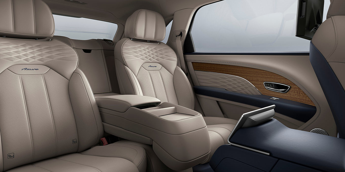 Bentley Zug Bentley Bentayga EWB Azure interior view for rear passengers with Portland hide featuring Azure Emblem in Imperial Blue contrast stitch.