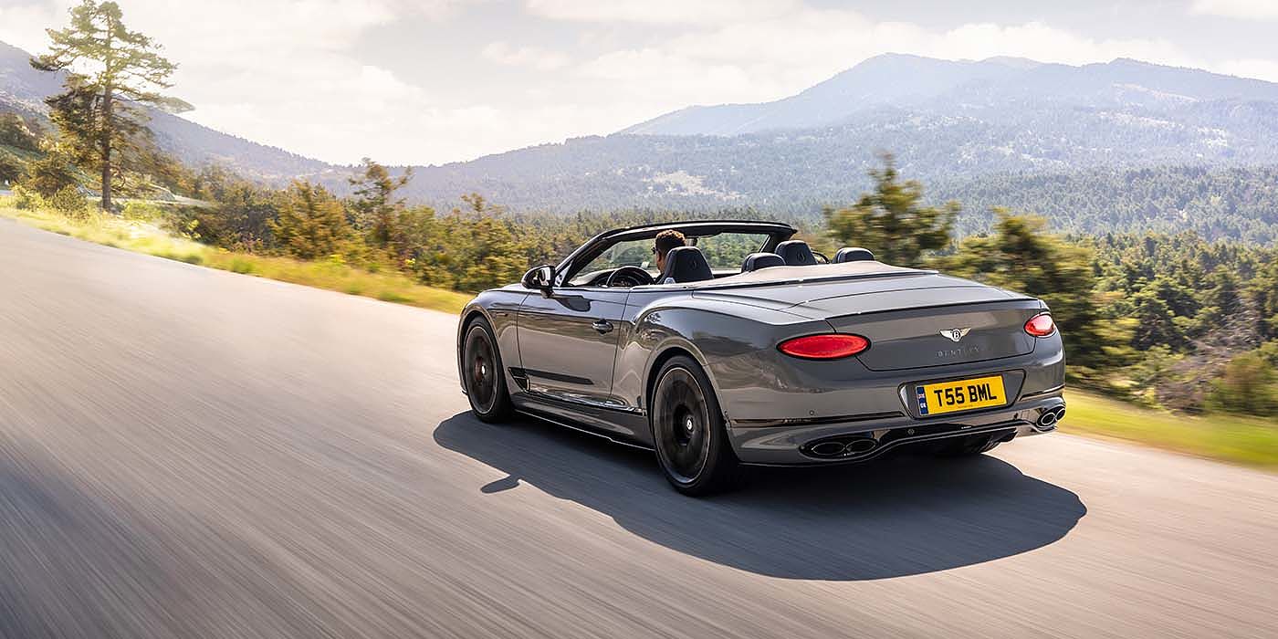 Bentley Zug Bentley Continental GTC S convertible in Cambrian Grey paint rear 34 dynamic driving