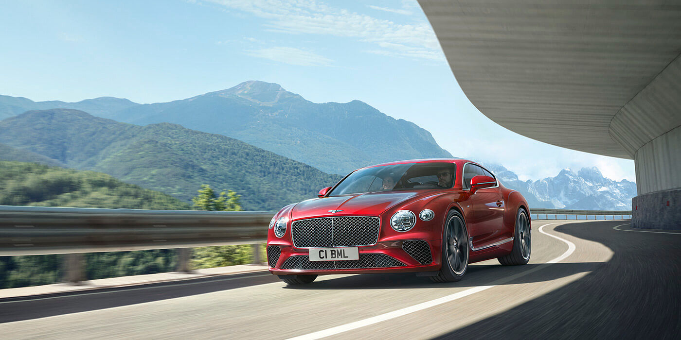 CONTINENTAL-GT-V8-DRIVING-BY-MOUNTAINS
