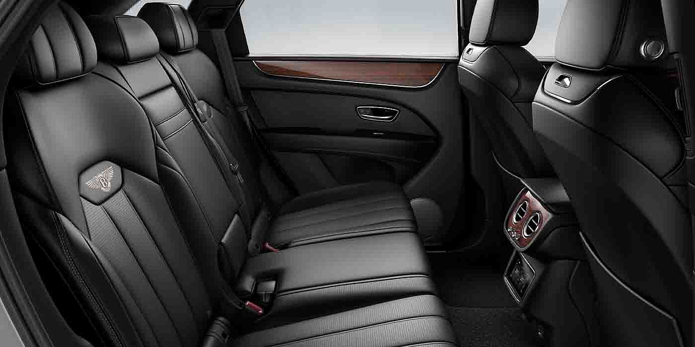 Bentley Zug Bentley Bentayga EWB interior view for rear passengers with Beluga black hide.