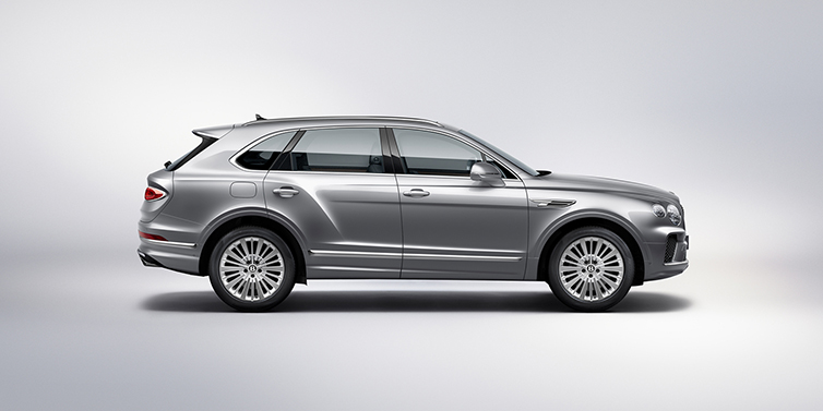 Bentley Zug Bentley Bentayga SUV side profile in Moonbeam silver paint against white background featuring 21 inch 5 spoke wheels