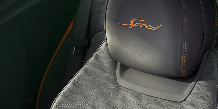 Bentley Zug Bentley Continental GT Speed coupe seat detail in Gravity Grey hide and Speed emblem in Mandarin by Mulliner coloured embroidery